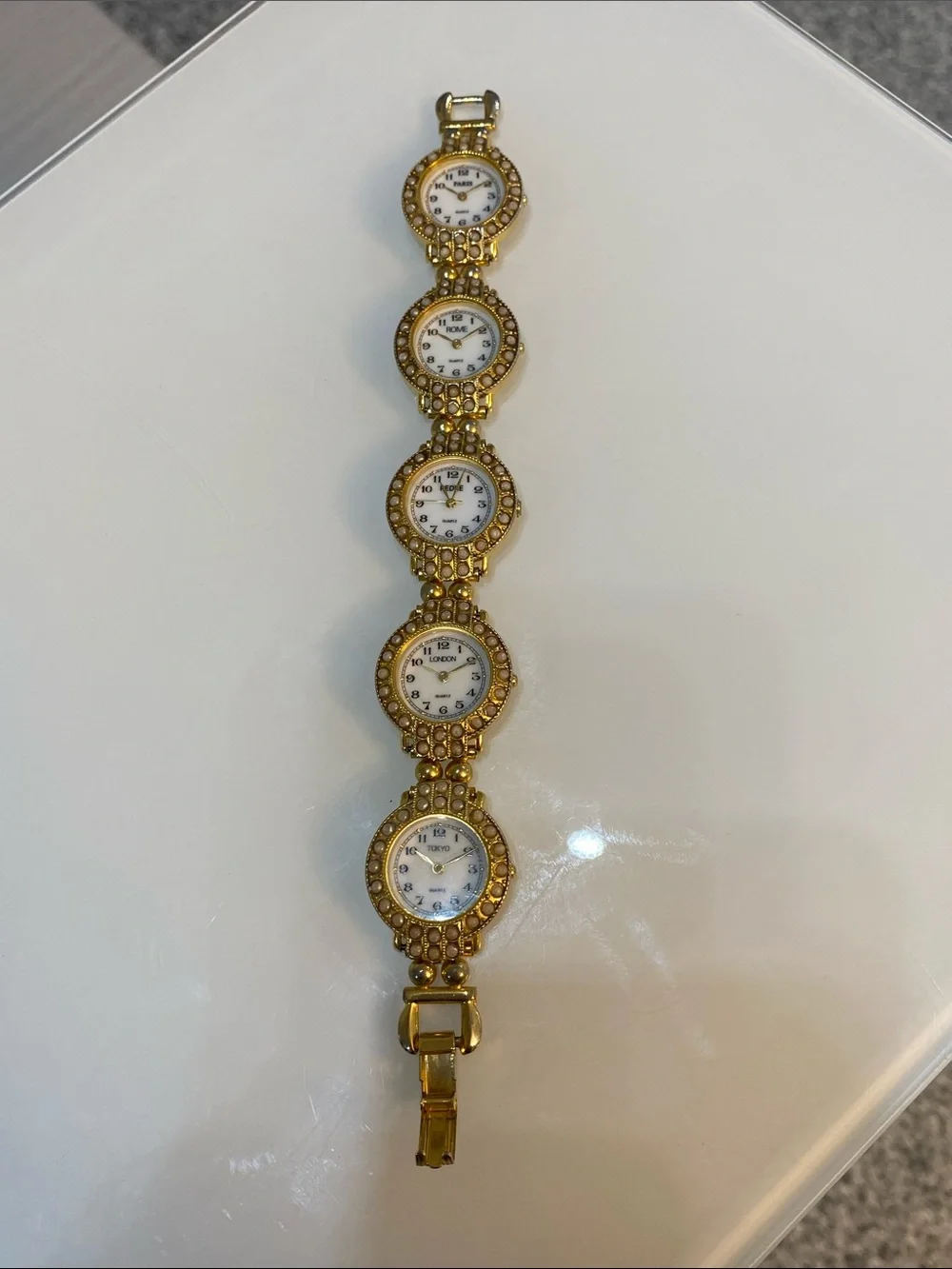 Faux pearl gold tone watch